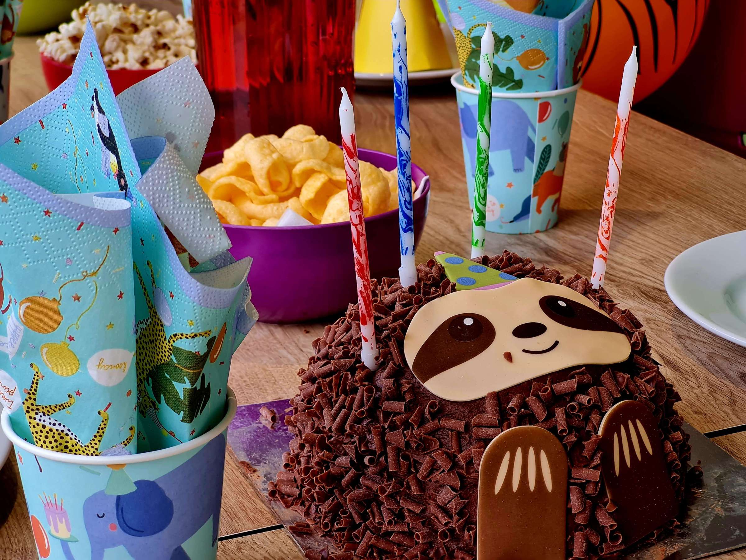 a birthday cake sitting on top of a party table