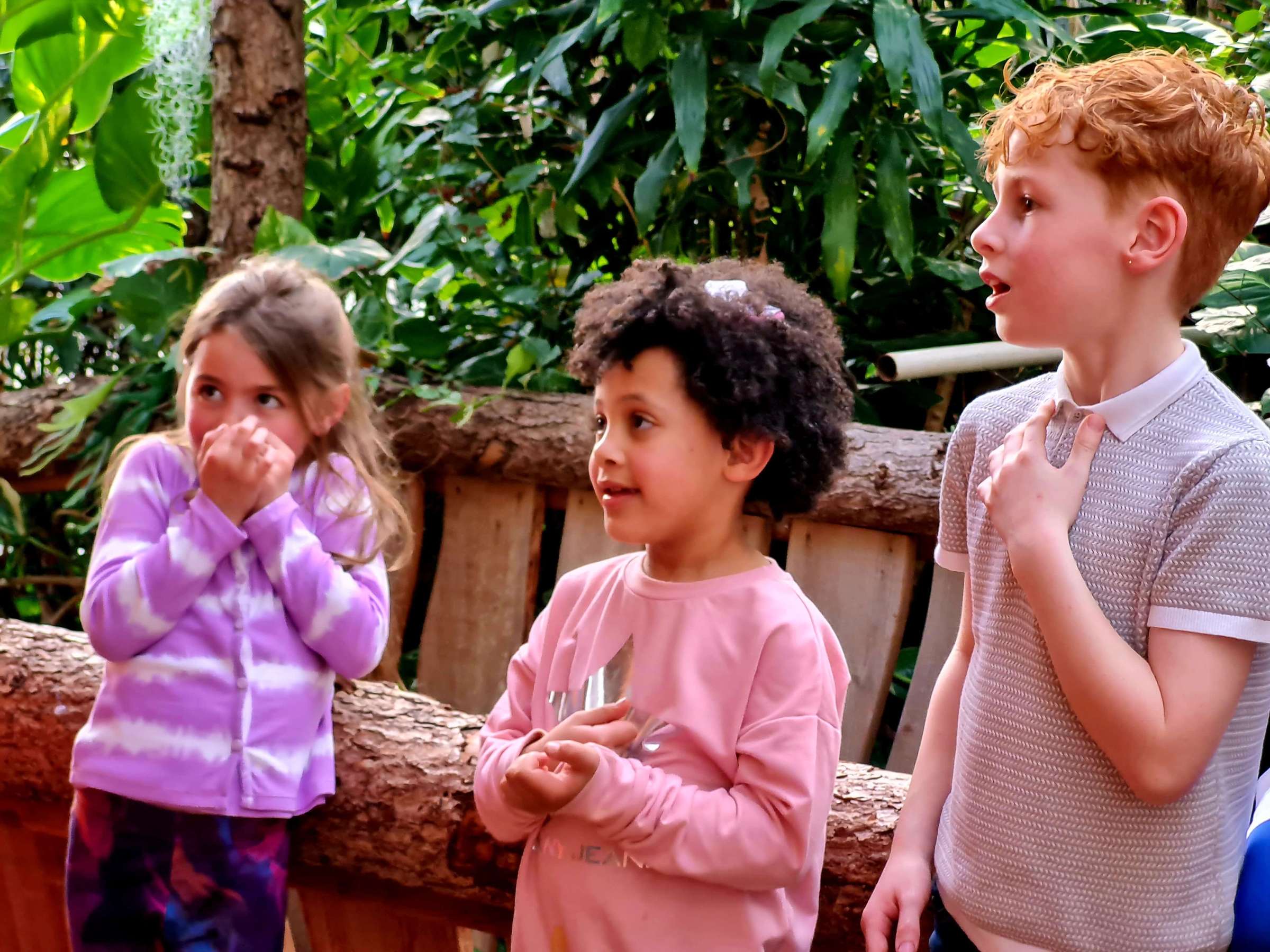 a group of children looking excited