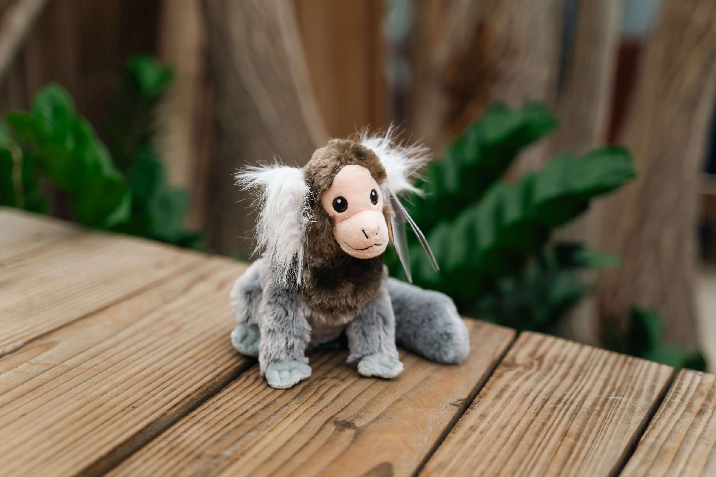 a marmoset toy sitting on top of a wooden table