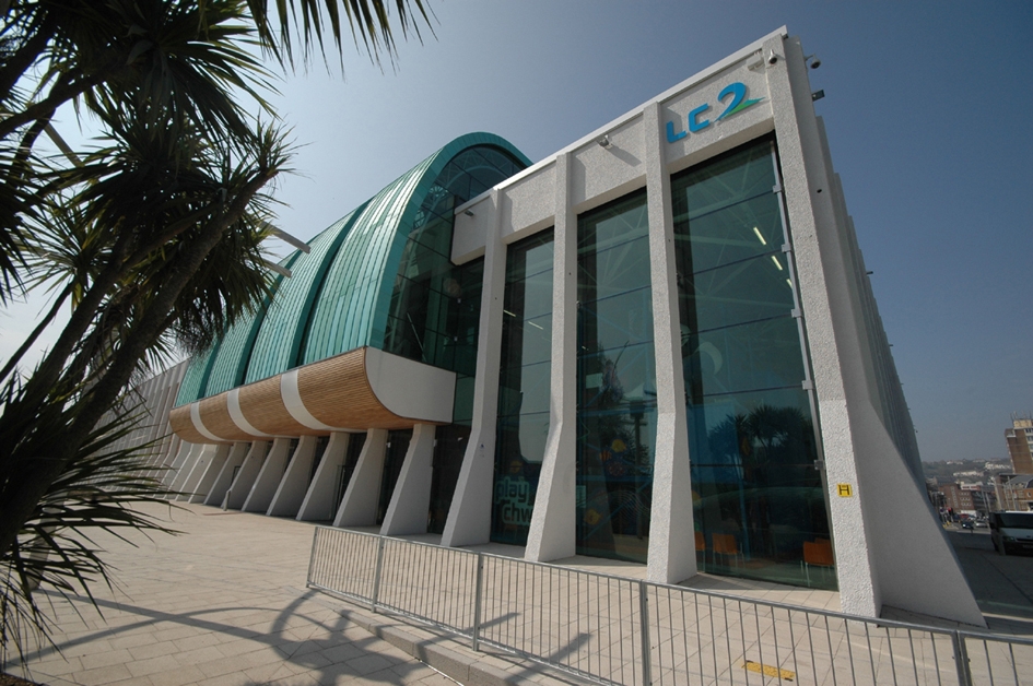 a palm tree in front of the LC2 building