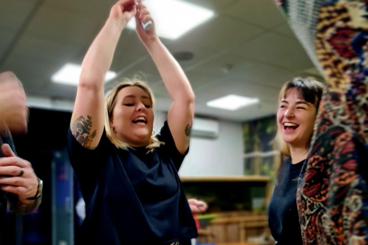 a woman jumping up in the air