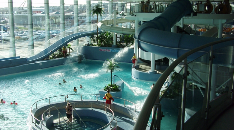 A photo of an indoor swimming pool and slides