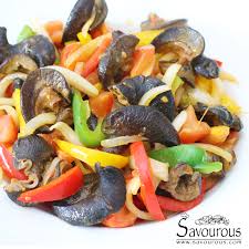 a plate of Spicy African Giant Snail with vegetables 