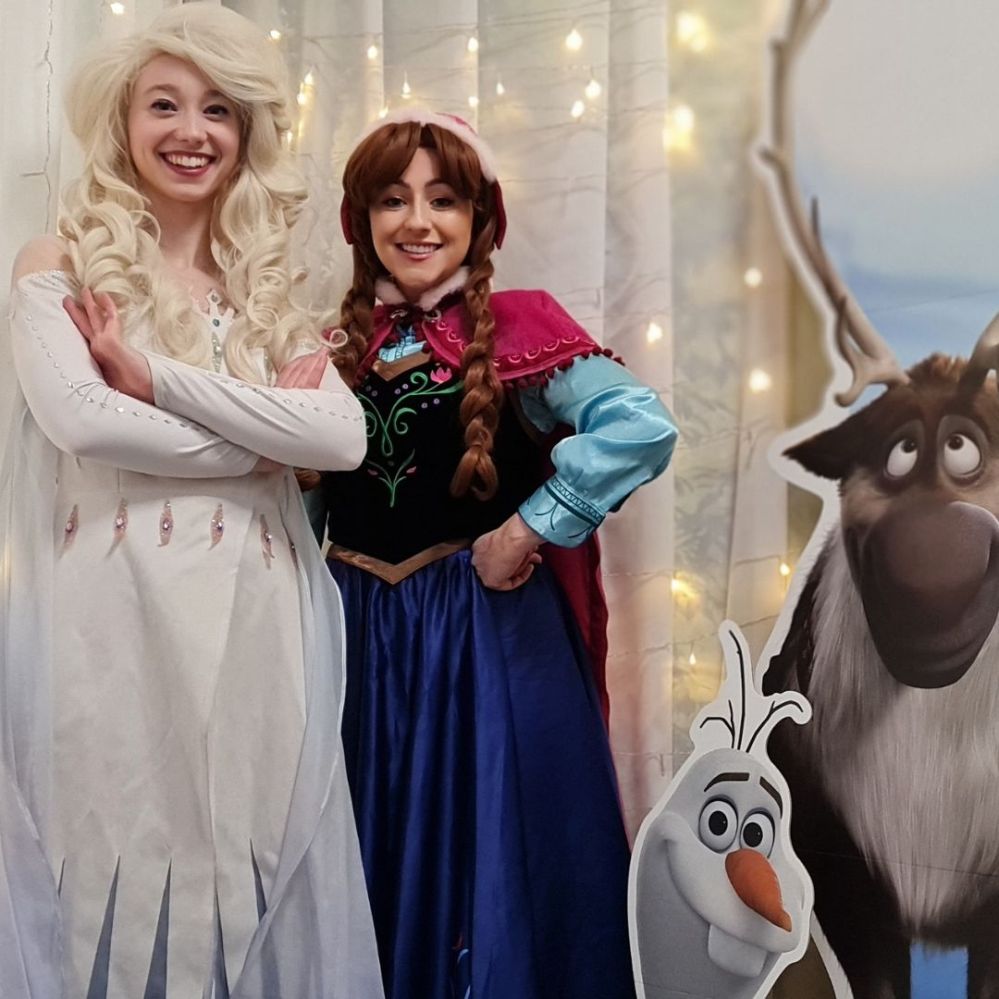 Ana, Elsa, Olaf & Sven  posing for the camera
