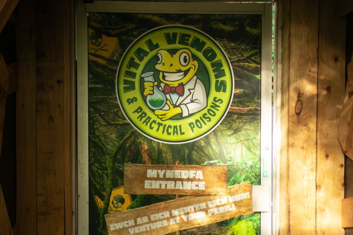 Door with 'Vital Venoms & Practical Poisons' logo featuring a cartoon frog.