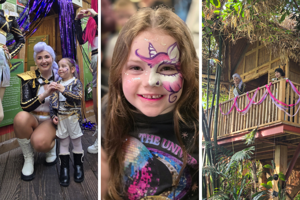 Woman with child in costumes, girl with unicorn face paint, people on treehouse balcony.